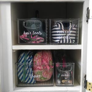 Organized Bathroom Cabinet with Labeled Bins for Makeup, Scents, Travel, Hair Tools, and Minis