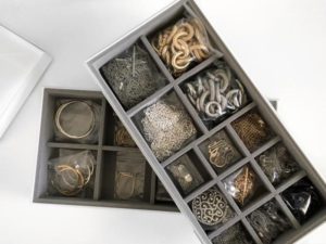 Jewelry Organized in Stacking Compartments