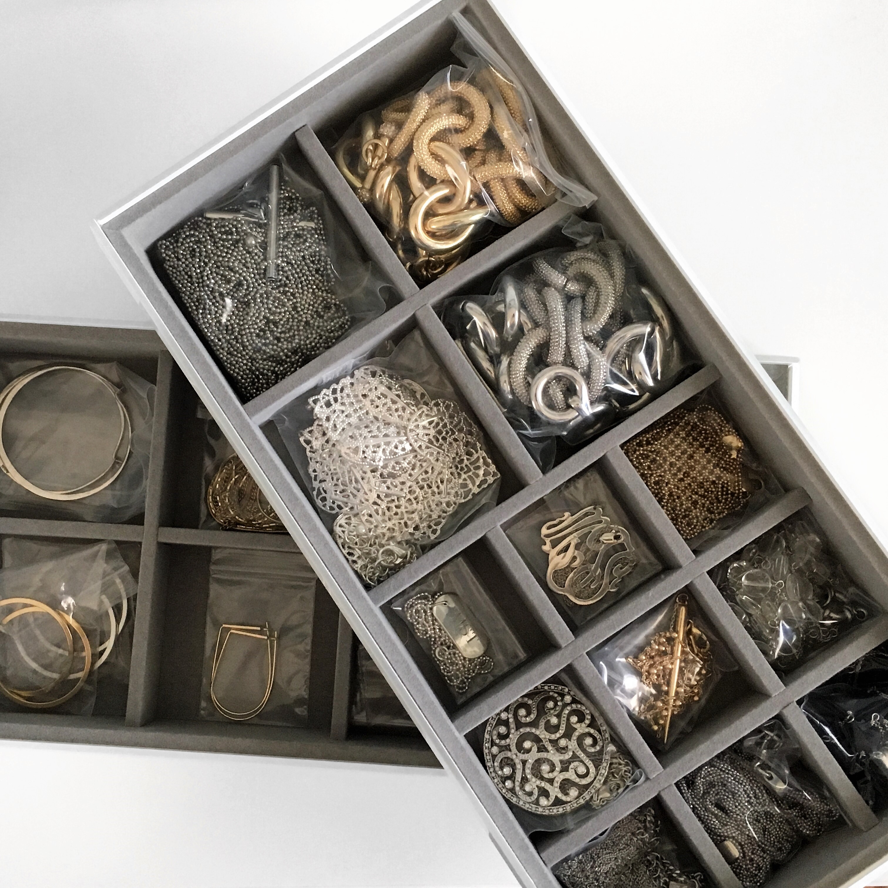 Jewelry Organized into Stacking Compartments